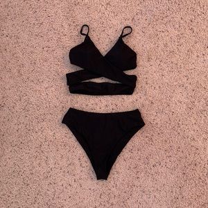 Black crisscross swimsuit w/ high waisted bottoms